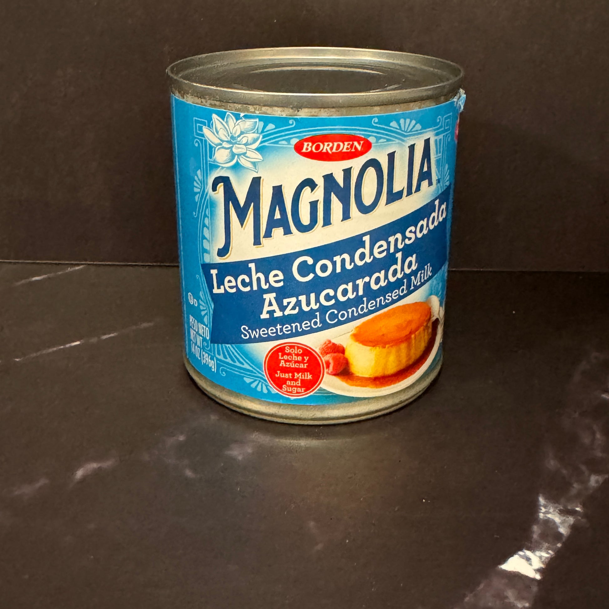 Leche Condensada Magnolia en lata de 14oz, ingrediente esencial para postres latinos disponible en Melomanda